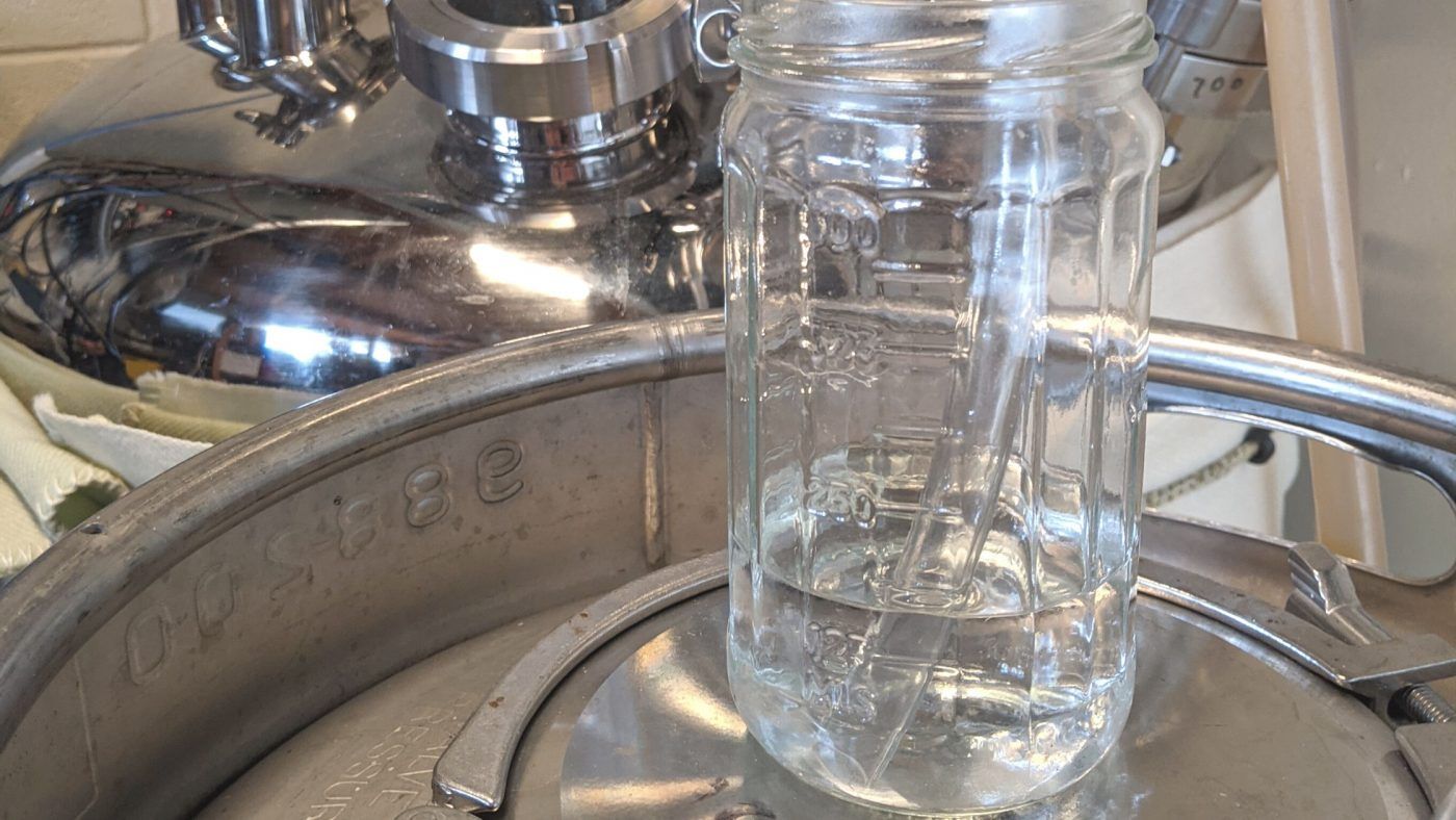 Image of diy distilling using small mason pickle jars to make distilling moonshine cuts