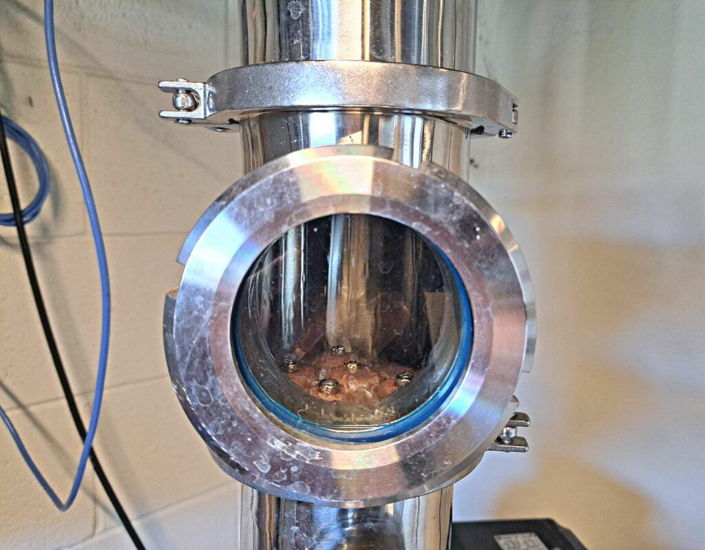 Image of diy distilling 4 inch reflux column with bubble plates opperating normally